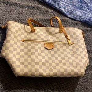 Louie Vuitton hand bag.